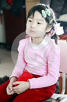 Chinese little girl watching TV
