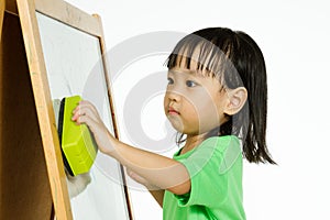 Chinese little girl writing on whiteboard