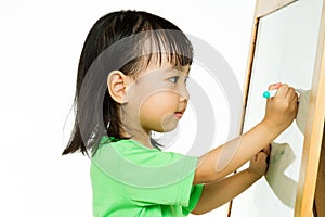 Chinese little girl writing on whiteboard