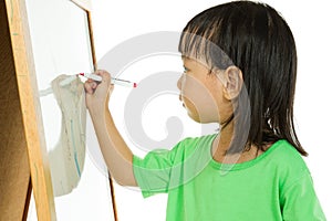 Chinese little girl writing on whiteboard