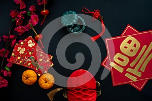 Chinese lunar new year decoration over black background.