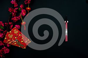 Chinese lunar new year decoration over black background.