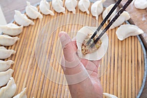 The Chinese are making meat dumplings