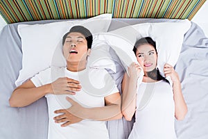 Chinese man snoring keeping his wife awake