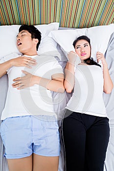 Chinese man snoring keeping his wife awake