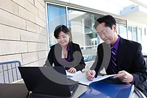 Chinese Man and Woman on Computer