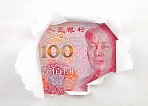 Chinese money behind hole in paper