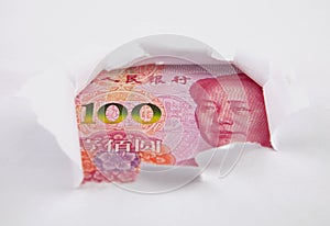 Chinese money behind hole in paper