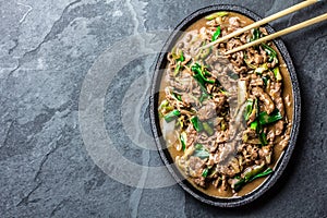 Chinese mongolian beef stir fry on iron plate