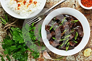 Chinese mongolian beef stir fry. Mongolian meat - beef stewed in