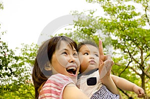 Chinese Mother and Baby Looking up