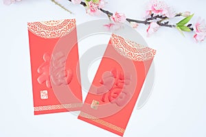 chinese new year celebration with angpao red and plum flowers