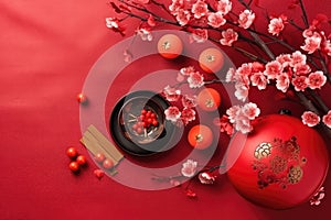 Chinese New Year festival decorations, mandarins, flowers, envelopes . Flat lay, top view. AI Generated