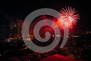 Chinese New Year fireworks over Makati at night, in Metro Manila photo