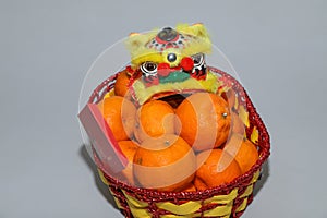 Chinese New Year mandarin oranges in basket decorate with Chinese dragon, Spring festival,ang pao