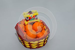 Chinese New Year mandarin oranges in basket decorate with Chinese dragon, Spring festival,ang pao