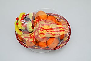 Chinese New Year, orange fruit basket with Chinese Dragon close up