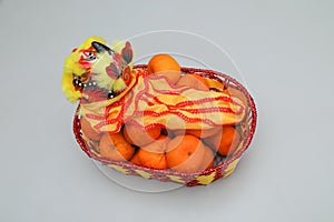 Chinese New Year, orange fruit basket with Chinese Dragon facing left close up