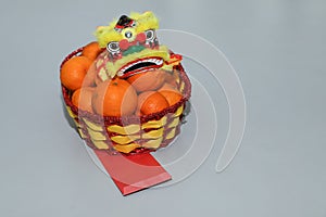 Chinese New Year, orange fruit basket with Chinese Dragon front view close up