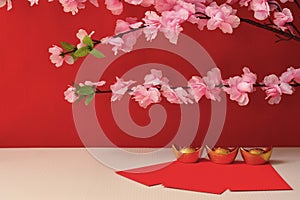 Chinese New Year Spring festival decorations pow or red packet and gold ingots or golden lump on a red background with plum
