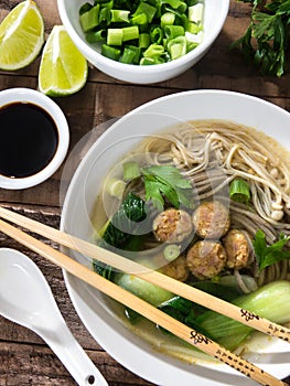 Chinese noodle soup with Chinese sausages and Japanese mushrooms