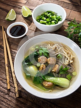Chinese noodle soup with Chinese sausages and Japanese mushrooms