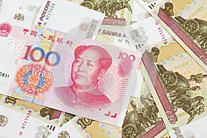 A Chinese one hundred Yuan bank note with Russian one hundred ruble bills