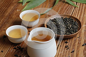 Chinese oolong tea, tea leaves and white cups