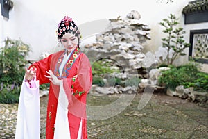 Chinese opera woman.Practicing Peking Opera in the garden, Colorful, china