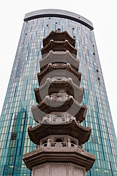 Chinese pagoda in front of a modern skyscraper