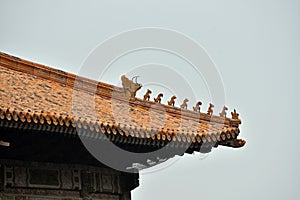 Chinese pagoda rooftop statues photo