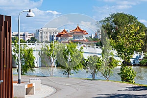 Chinese pagoda tower on the shore of a pond in Singapore