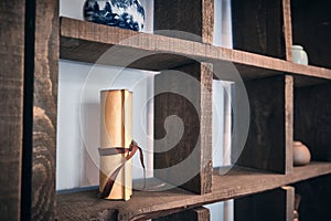 Chinese paper scroll and traditional teaware on the shelves in the tea house