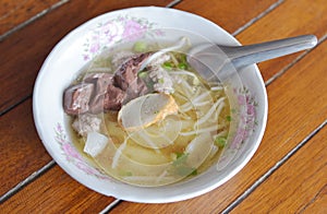 Chinese pasta square soup on wooden table