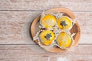 Chinese pastry bakery topping with black and white sesame  seeds on wooden tray ,top view