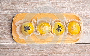 Chinese pastry bakery topping with black and white sesame  seeds on wooden tray ,top view