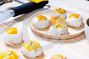 Chinese pastry moon cake with cup of tea and baking tools