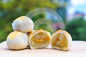 Chinese pastry puff, Beans cake with salted egg yolk lay on wood