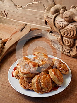Chinese pastry and wooden dragon