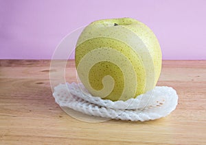 Chinese pear with epe net foam on the wooden table