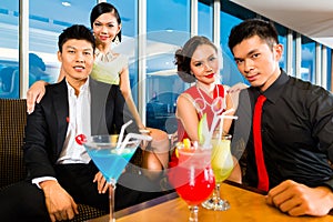 Chinese people drinking cocktails in luxury cocktail bar