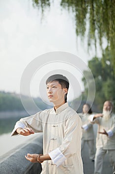 Chinese People Practicing Tai Ji, Hands in Circle, Outdoors