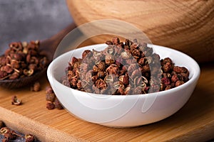 Chinese pepper, Sichuan pepper in bowl. Dry Sichuan Pepper Spice.