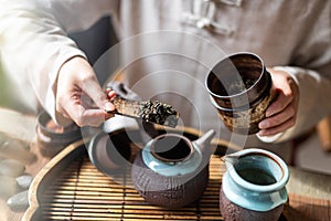 Chinese pouring tea leaf
