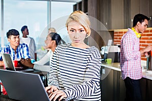 Chinese programmer in lounge of IT start-up