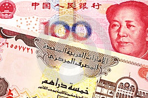 A Chinese renminbi one hundred yuan note with cash from the United Arab Emirates in macro