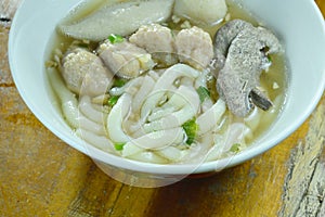 Chinese rice flour noodles topping minced pork and liver with fish ball in soup on bowl