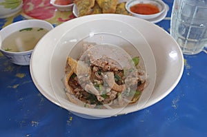 Chinese rice noodle soup with pork , fish ball