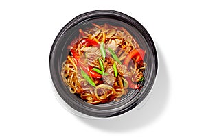Chinese rice noodles with veal, bell peppers and carrots in stir fry sauce with chopped scallions
