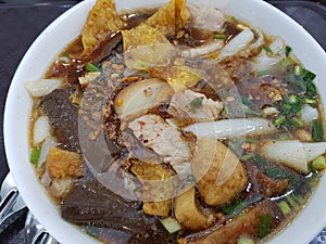 Chinese roll noodle soup name `Kuay Jab` thai food closed up photo